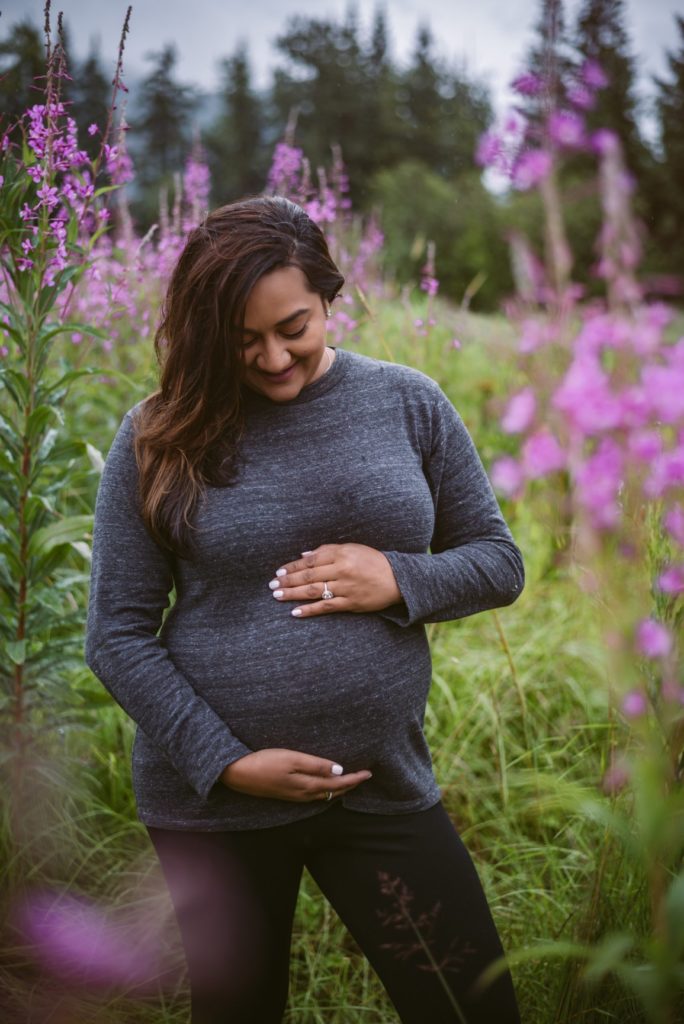 pregnant woman in a fireweed field