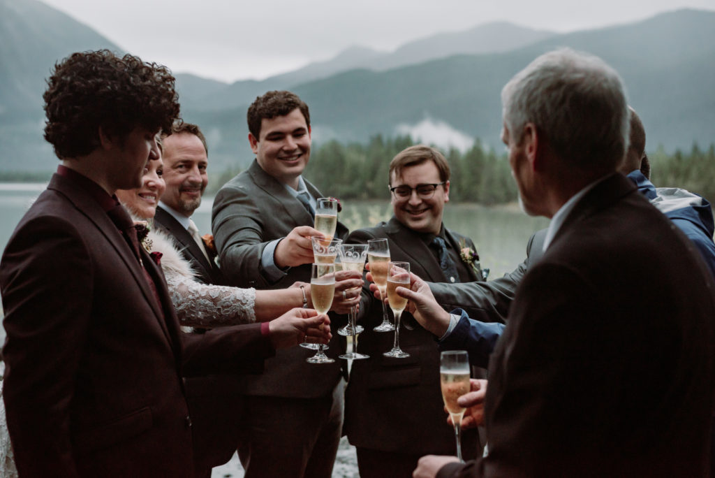 champagne toast in front of a glacier under soaring bald eagles in juneau alaska
