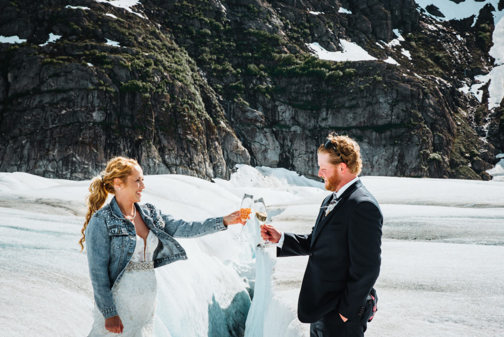 champagne toast over a crevasse on an alaskan glacier