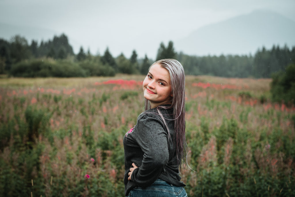 headshots in front of a fireweed field as the fireweed turn from pink to red