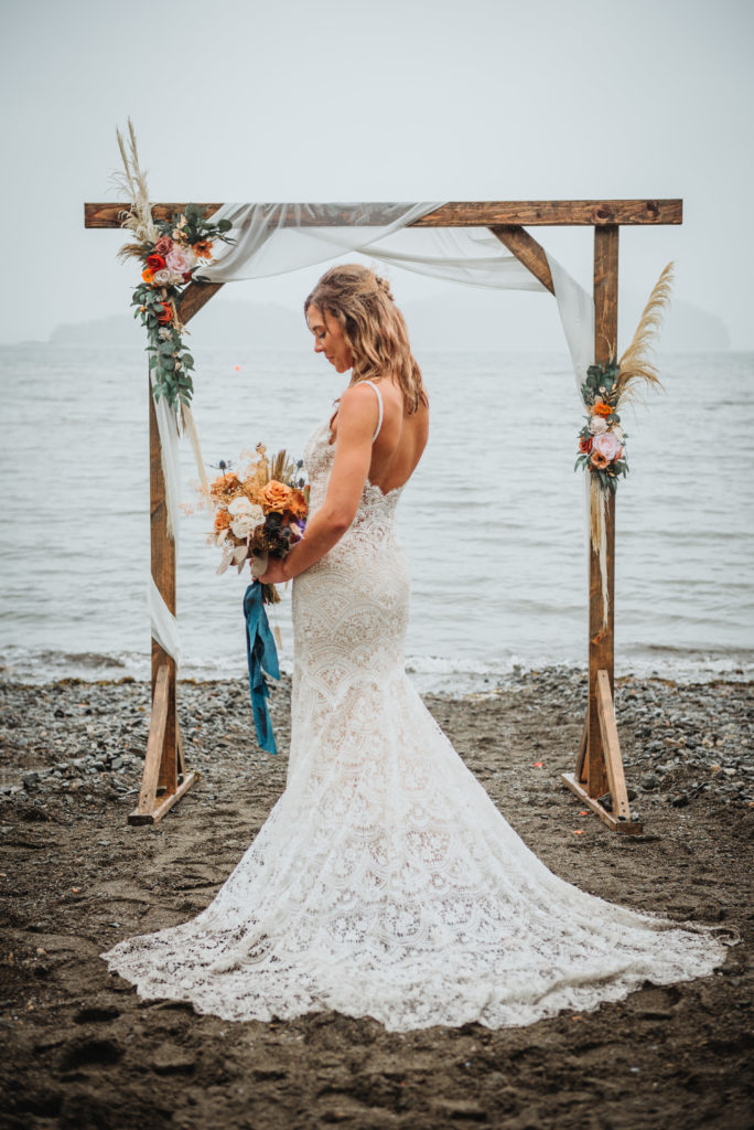 bride on the beach after an alaska beach elopement