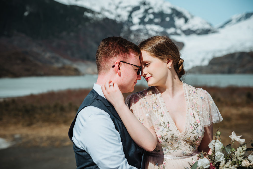 eloping couple in front of the mendenhall glacier