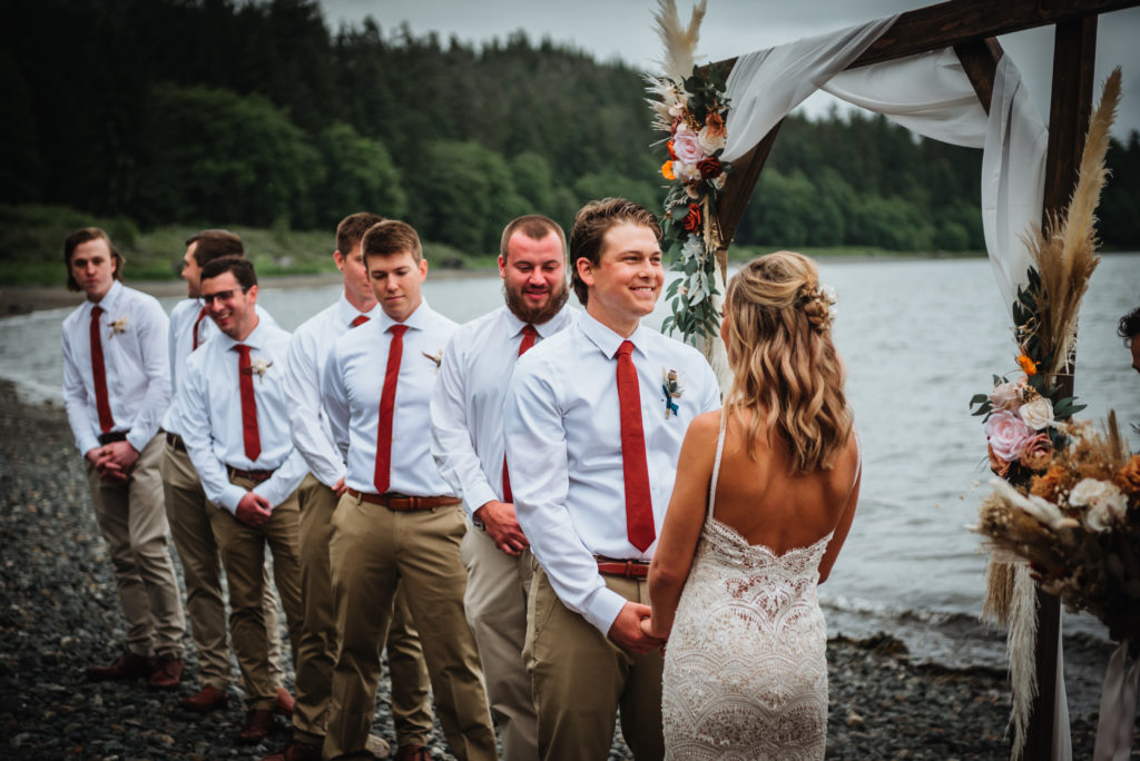 groom and groomsmen during beach wedding ceremony