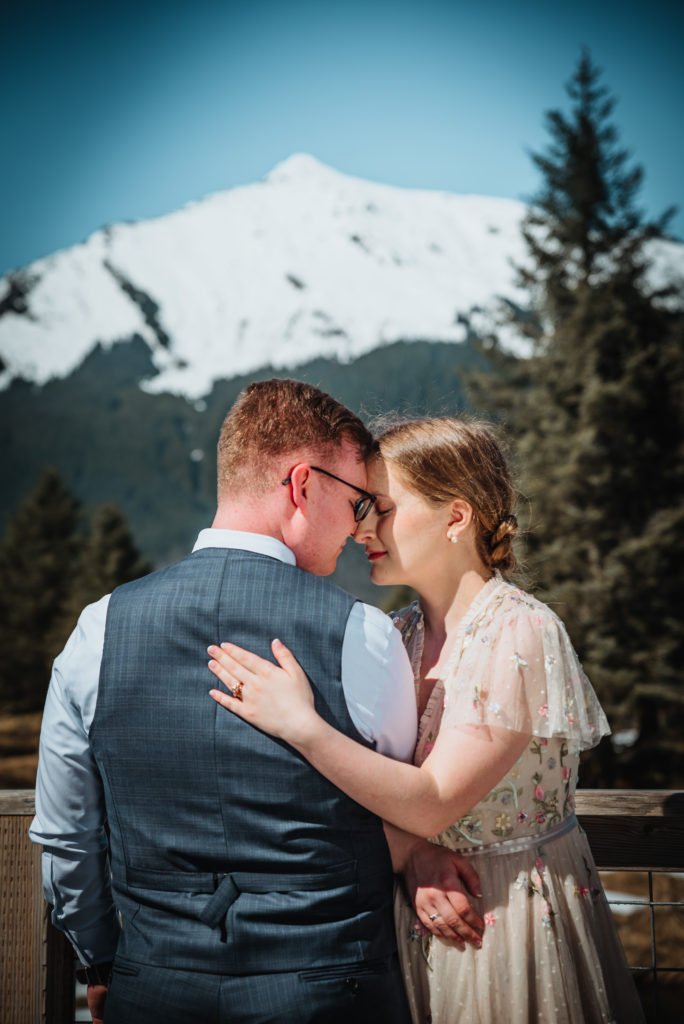 bride and groom embracing at mendenhall glacier