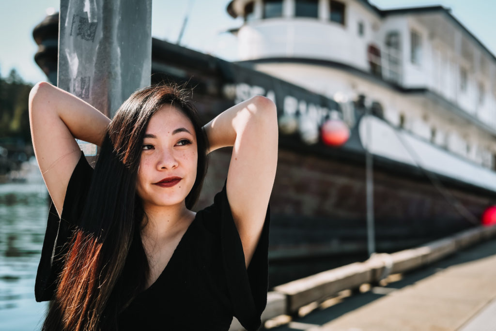 Personal branding photoshoot of Rizza Marvel of Z Squared studio in front of tug boat in juneau alaska