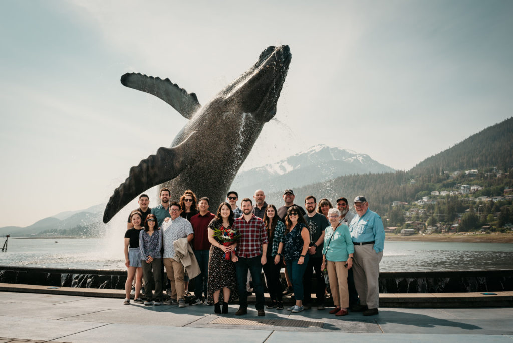 group photos at the tahku whale statue in juneau alaska