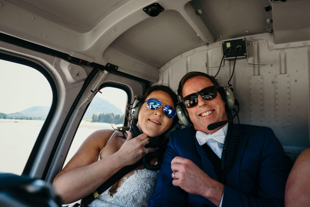 bride and groom in helicopter 