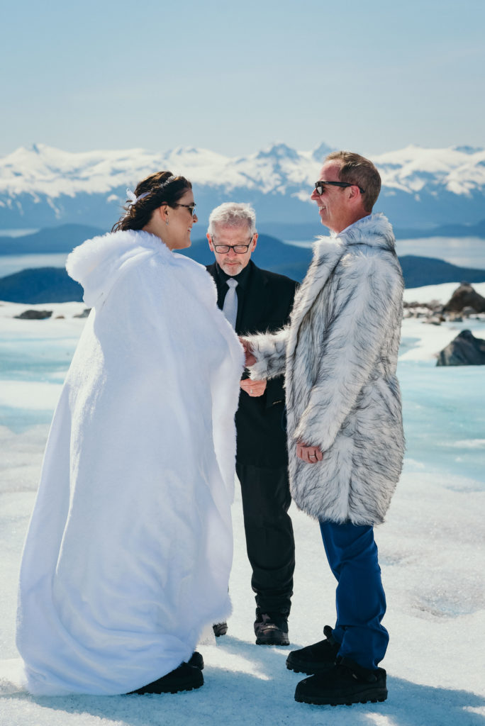 bride groom and officiant on herbert glacier