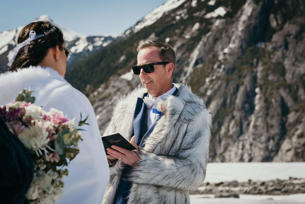 groom smiling during alaska glacier ceremony