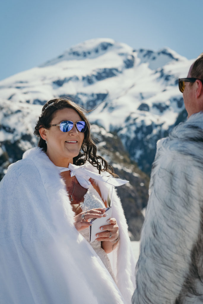 bride smiling at groom during alaska glacier wedding