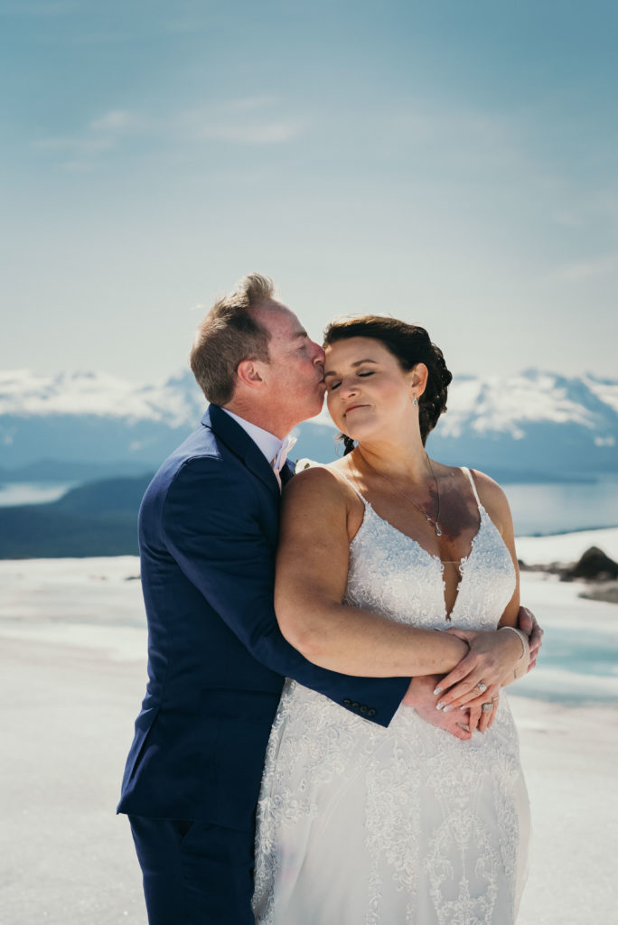bride and groom on juneau glacier