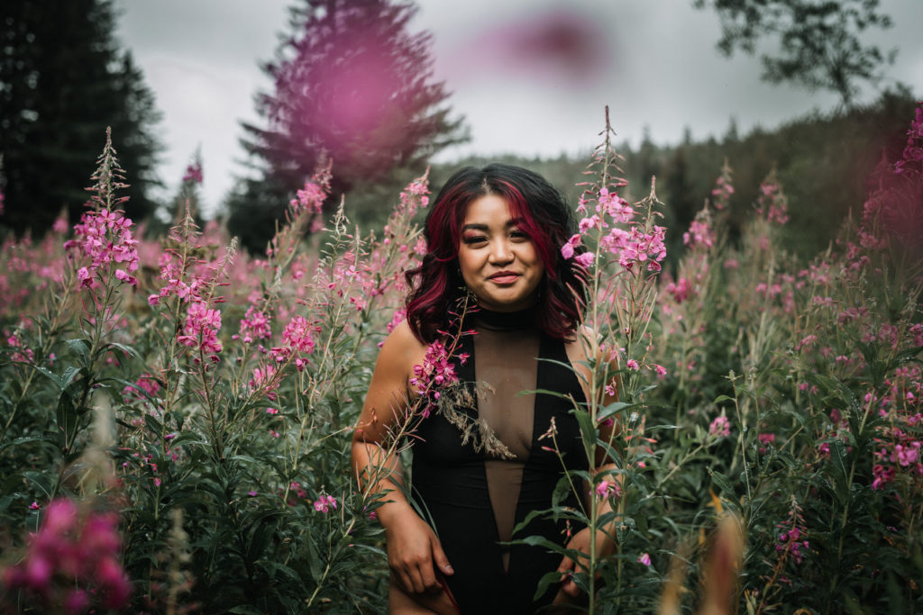 woman in wildflowers during outdoor boudoir session