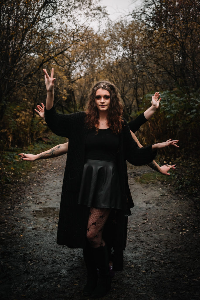 witchy woman in black at witchy styled shoot
