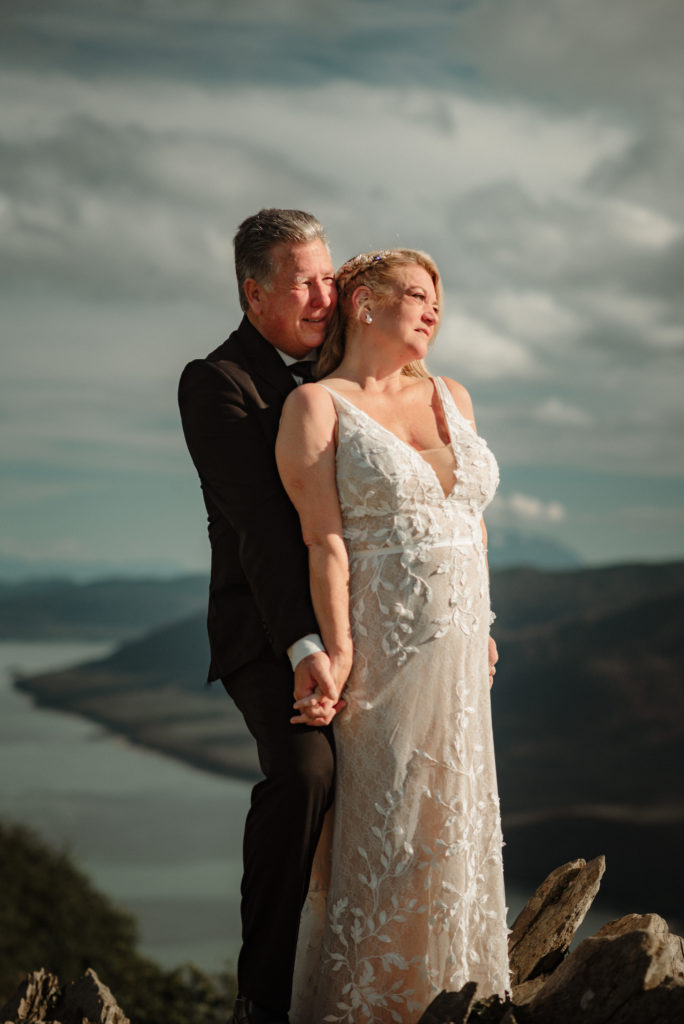 bride and groom with epic mountain peak views