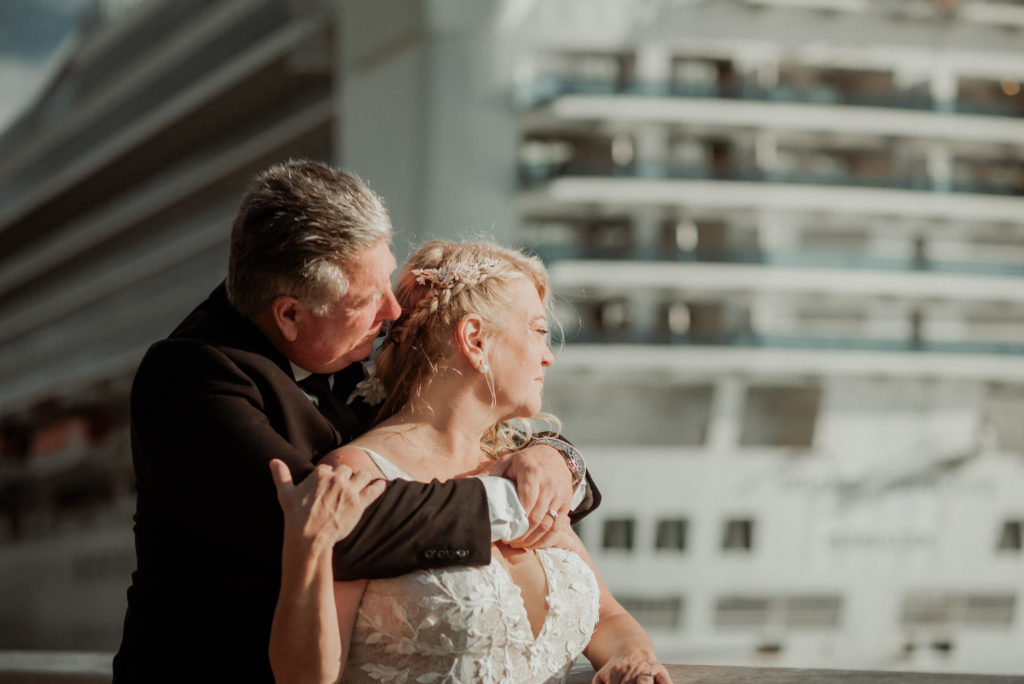 bride and groom on docks after juneau elopement