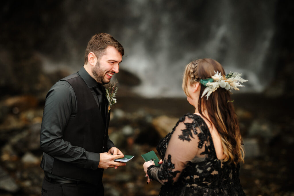 Dark and moody waterfall elopement with enchanted forest and smores
