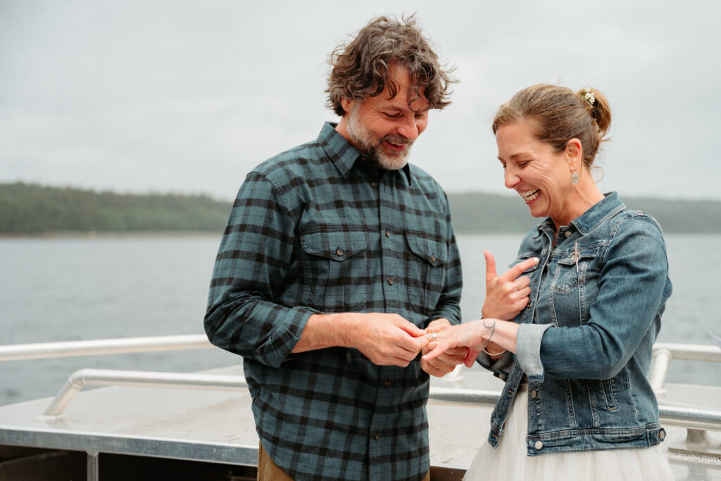 Couple eloping on charter boat in Auke Bay Juneau Alaska
